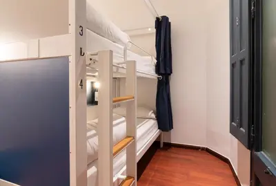 a bunk bed room with two bunk beds at The Central House Barcelona Gracia in Barcelona