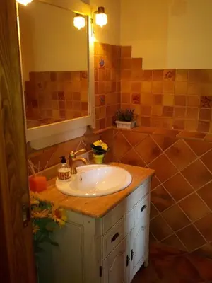 a bathroom with a sink and a tub at Ca L'Estrada in Sant Esteve de Palautordera