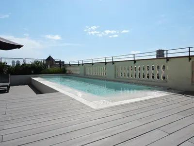a swimming pool on the roof of a building at Hotel Raval House in Barcelona