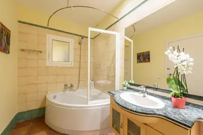 a bathroom with a tub and a sink at RamblasRentals Chic & Spacious Flat Pool Table 15M Ramblas - Parking - Wifi in Barcelona