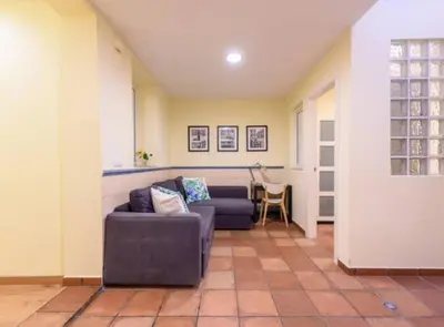a living room with a couch and a table at RamblasRentals Chic & Spacious Flat Pool Table 15M Ramblas - Parking - Wifi in Barcelona