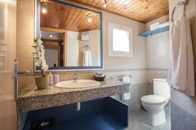a bathroom with a sink and a toilet at BCNGOTIC 50 in Barcelona