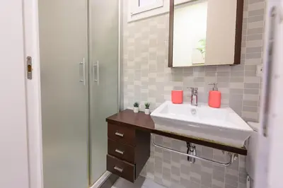 a bathroom with a sink and a shower at RamblasRentals Design Renovated Apartment AC Balcony10m Ramblas - Parking - Wifi in Barcelona