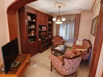 a living room with a couch and chairs and a television at Cal Llopet in Can Cartro
