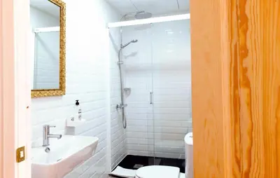 a bathroom with a shower and a sink and a toilet at My Address in Barcelona in Barcelona