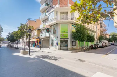 a city street with a building on the side of the road at HomeHolidaysRentals Arlene in Calella