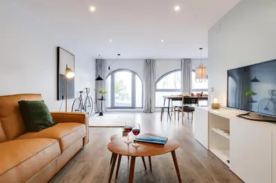 a living room with a couch and a table at Sweett - Verdi in Barcelona