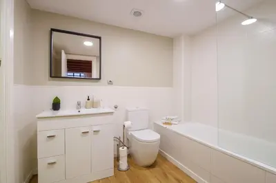 a bathroom with a toilet and a sink and a shower at Sweett - Verdi in Barcelona