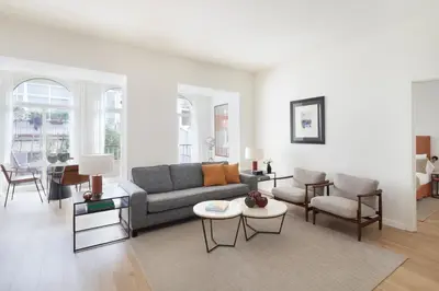 a living room with a couch and chairs at Murmuri Residence Concepció in Barcelona