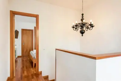 a dining room with a chandelier and a mirror at Stay U-nique Apartments Plaça de Tetuan in Barcelona