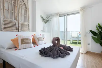 a bedroom with a bed with a towel on it at matarolux17 in Mataró
