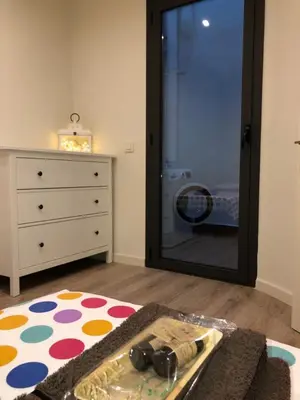 a bedroom with a dresser and a large mirror at Calella Playa Vistas Mar in Calella