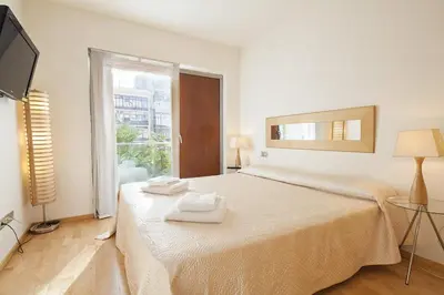 a bedroom with a bed with two towels on it at Spacious Duplex in Barcelona with outdoor terrace - 180 m² in Barcelona
