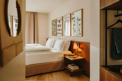 a bedroom with a bunk bed and a wooden table at Hotel Casa Luz in Barcelona