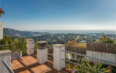 a balcony with a view of the ocean at Gorgeous Home In Sant Cebrià De Vallalt in San Cipriano de Vallalta