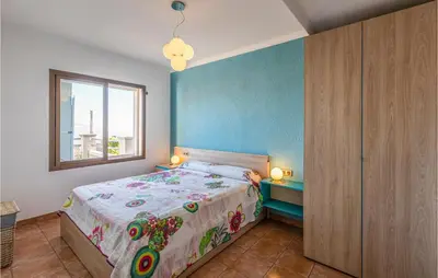 a bedroom with a bed and a window at Gorgeous Home In Sant Cebrià De Vallalt in San Cipriano de Vallalta