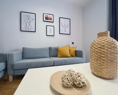 a living room with a couch and a table at Stay U-nique Apartments Diagonal in Barcelona