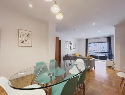 a dining room with a glass table and chairs at Stay U-nique Apartments Diagonal in Barcelona