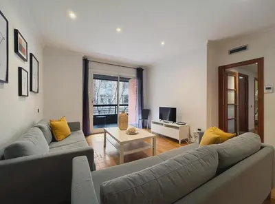 a living room with a couch and a table at Stay U-nique Apartments Diagonal in Barcelona
