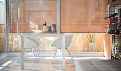 a white table and two white chairs in a room at Magnificent apartment close to the beach in Barcelona