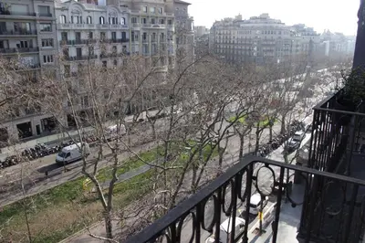 a balcony with a view of a city with buildings at Mr. Serrano Apartments in Barcelona