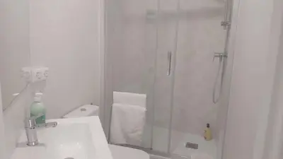 a bathroom with a shower and a toilet and a sink at Chopin Magic Fountain in Barcelona