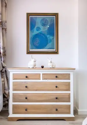 a dresser with two rabbits sitting on top of it at Lux Apartments Barcelona in Barcelona