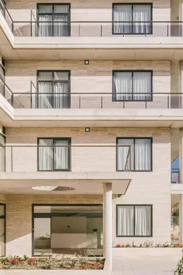 an exterior view of a building with windows at CIM Aparthotel in Sant Cugat del Vallès