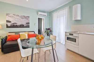 a living room with a glass table and a couch at Easystaybcn2 in Barcelona