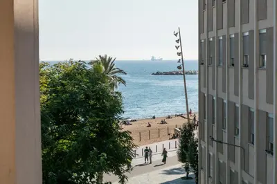 a view of a beach from a building at Easystaybcn2 in Barcelona