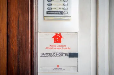 a sign for a baroda hospital on a wall at Casa Barcelo Hostel Barcelona in Barcelona