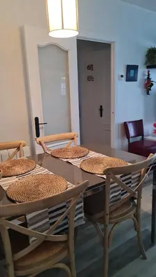 a dining room table with two chairs and a table and chairsktop at Apartment in front of the Beach in Pineda de Mar