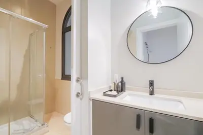 a bathroom with a sink and a mirror at Sweett - Sepulveda in Barcelona