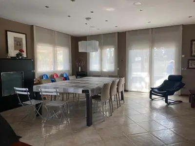 a dining room with a large table and chairs at Can Ramón in Caldes de Montbui