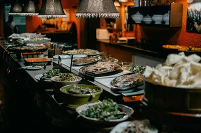 a buffet line with many dishes of food on at El Folló Turisme Rural in Tagamanent