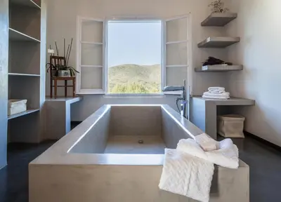 a large bath tub in a bathroom with a window at Casa Nova Estate in Sitges