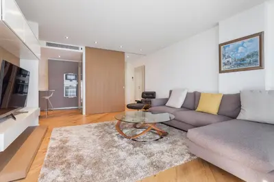 a living room with a couch and a table at HHBCN Beach Apartment Gava #2 in Gavà