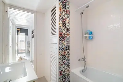 a bathroom with a tub and a sink and a shower at LIANA SEAVIEW & BEACH - apartment in Montgat