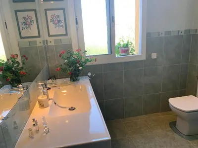 a bathroom with a sink and a toilet at Villa Dacar in Cubelles