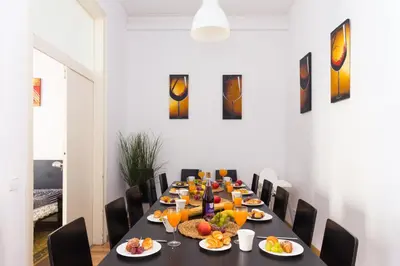 a long table with plates of food and orange juice at Key Plaza Universidad - Gran Via in Barcelona