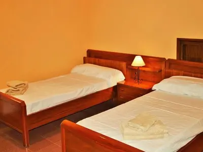 a bedroom with two beds and a lamp at Villa in Sant Pol near Crystal Beach in San Pol de Mar