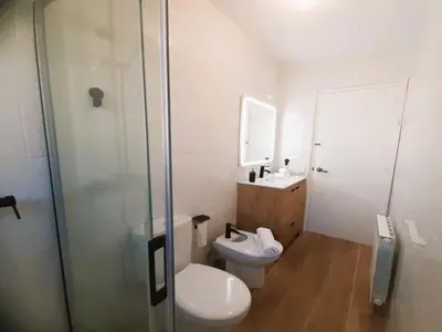 a bathroom with a toilet and a sink and a shower at Villa in Sant Pol near Crystal Beach in San Pol de Mar
