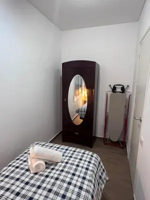 a room with a bed with a round mirror at VIU BARCELONA BERTRAN in Barcelona