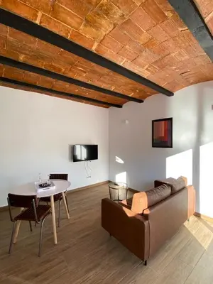 a living room with a couch and a table at VIU BARCELONA BERTRAN in Barcelona