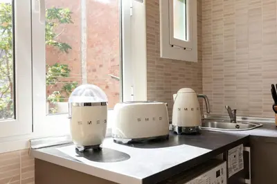 two hello kitty machines sitting on a kitchen counter at Urban Apartments in Barcelona
