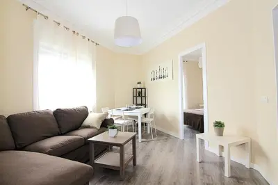 a living room with a couch and a table at FELIP - Spacious and quiet apartments & one with Terrace in Barcelona