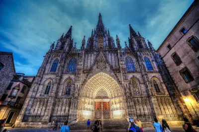 a large cathedral with people standing in front of it at MUNNE - Spacious apartments next to FC Barcelona in Barcelona