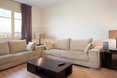 a living room with a couch and a coffee table at RIUS - Apartments & one Penthouse with private terrace in Montjuic in Barcelona