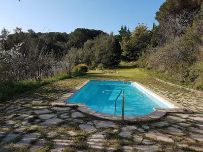 an empty swimming pool in the middle of a field at Villa in Maresme near Montnegre Park in Sant Iscle de Vallalta