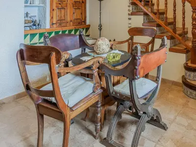 a dining room table with four chairs around it at Villa in Maresme near Montnegre Park in Sant Iscle de Vallalta